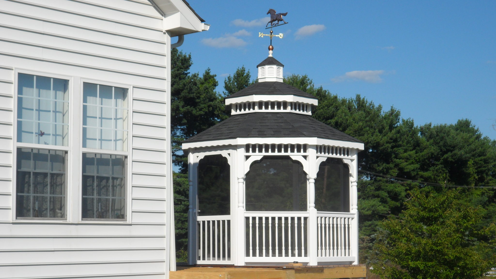 10' Vinyl Octagon, Colonial Rails, Turned Posts, Wavy Fascia, Pagoda Roof, Asphalt Shingles, Screen Package